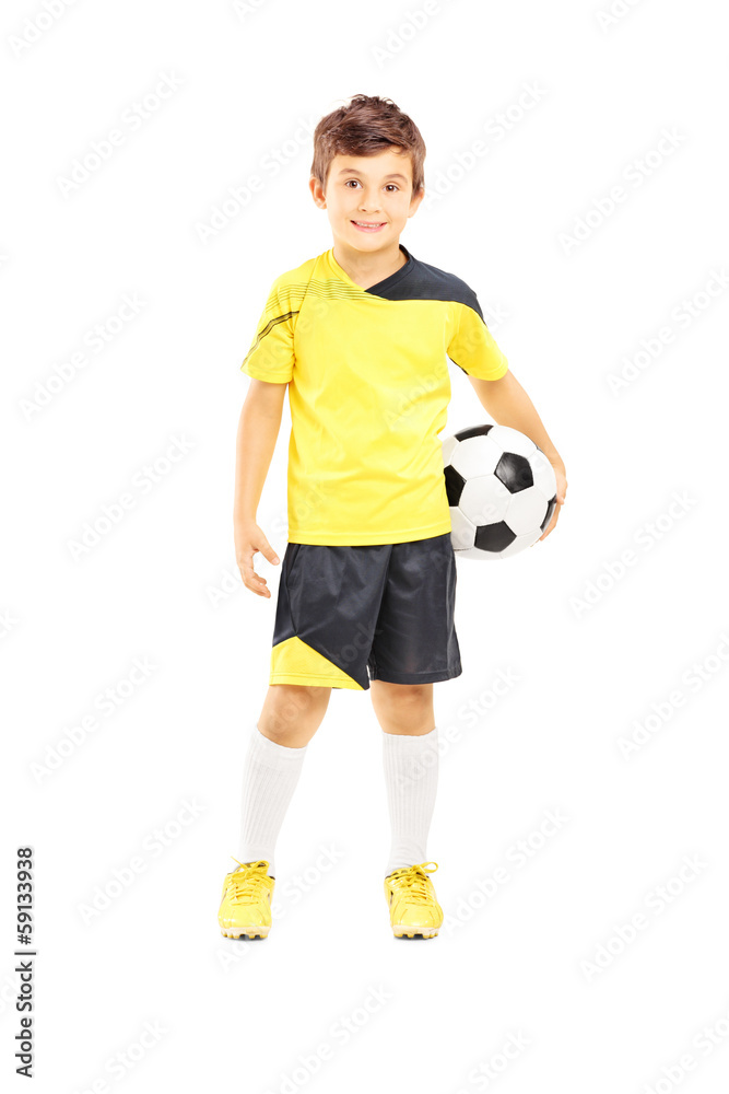 Full length portrait of a kid in sportswear with a soccer ball Full length portrait of a kid in sportswear with a soccer ball