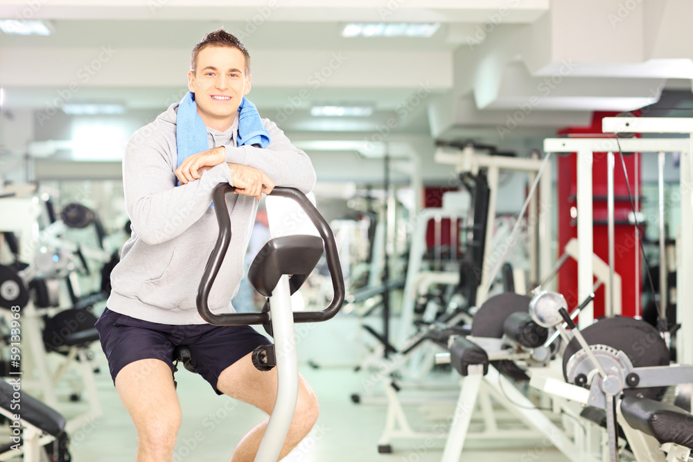 Young smiling man resting after cardio training Young smiling man resting after cardio training