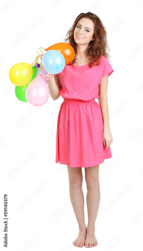 Fototapeta premium Smiling young woman in pink dress holding colorful balloons, celebrating party and happiness, isolated on white background