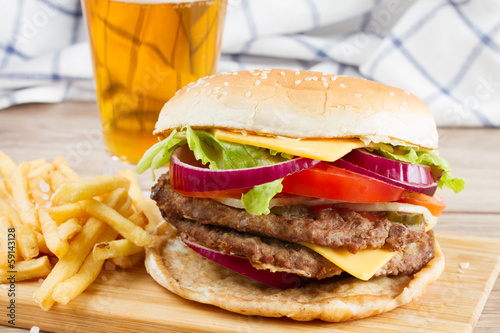 Big burger with french fries and beer