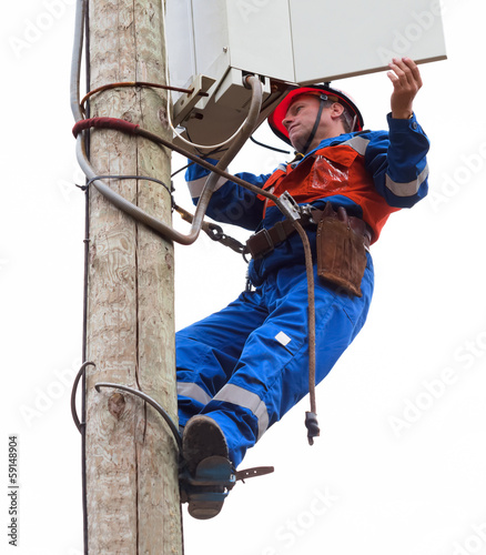 Electrician opened the control panel on the pole reclosers photo