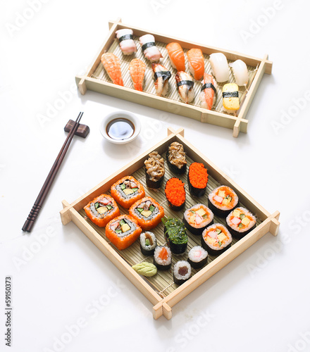 Japanese seafood sushi , rolls and chopstick for two plates