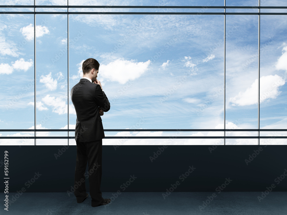 businessman looking to sky