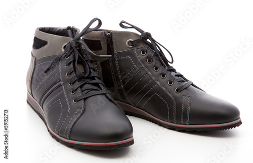 black, man's boots on a white background