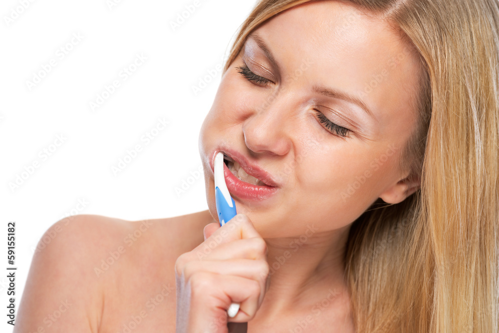 Portrait of happy teenage girl brushing teeth Portrait of happy teenage girl brushing teeth