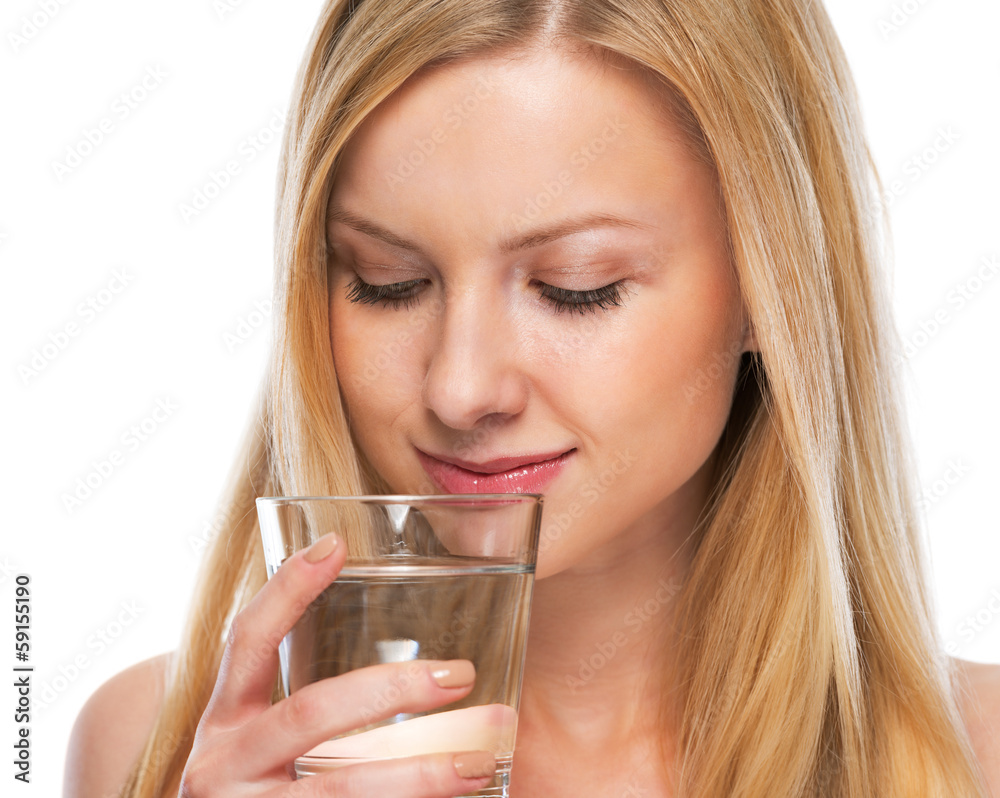 Portrait of happy teenage girl with cup of water Portrait of happy teenage girl with cup of water