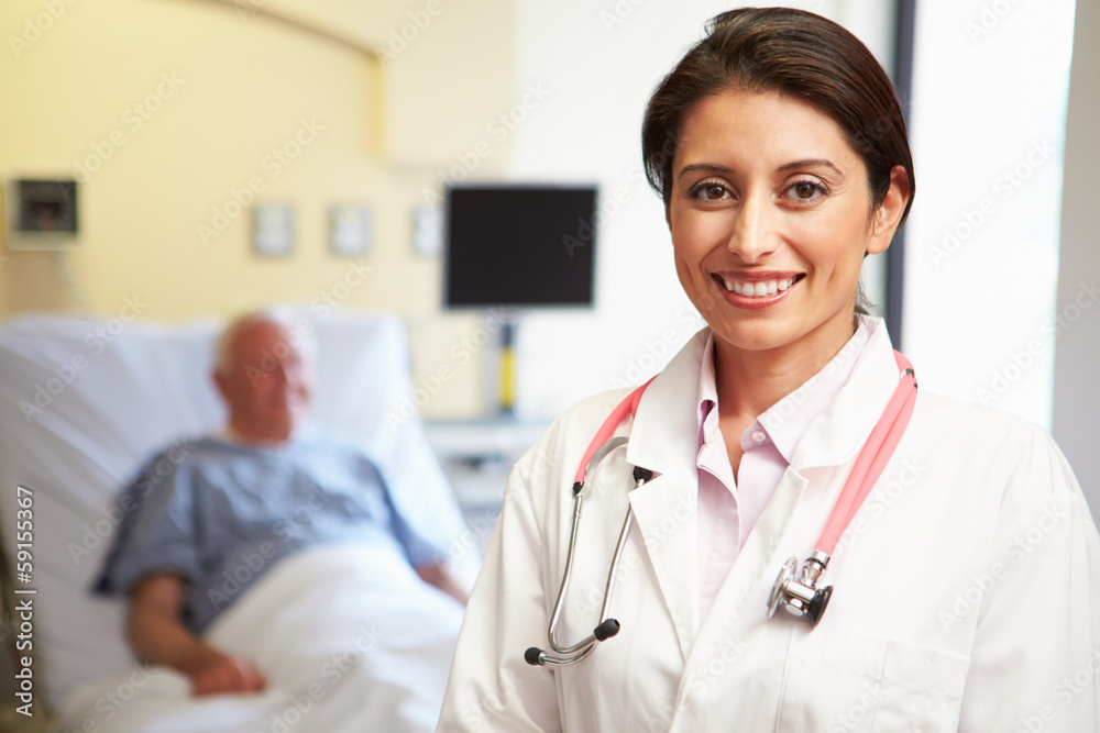 Portrait Of Female Doctor With Patient In Background Portrait Of Female Doctor With Patient In Background