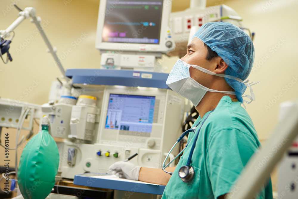 Anesthetist Working In Operating Theatre Anesthetist Working In Operating Theatre