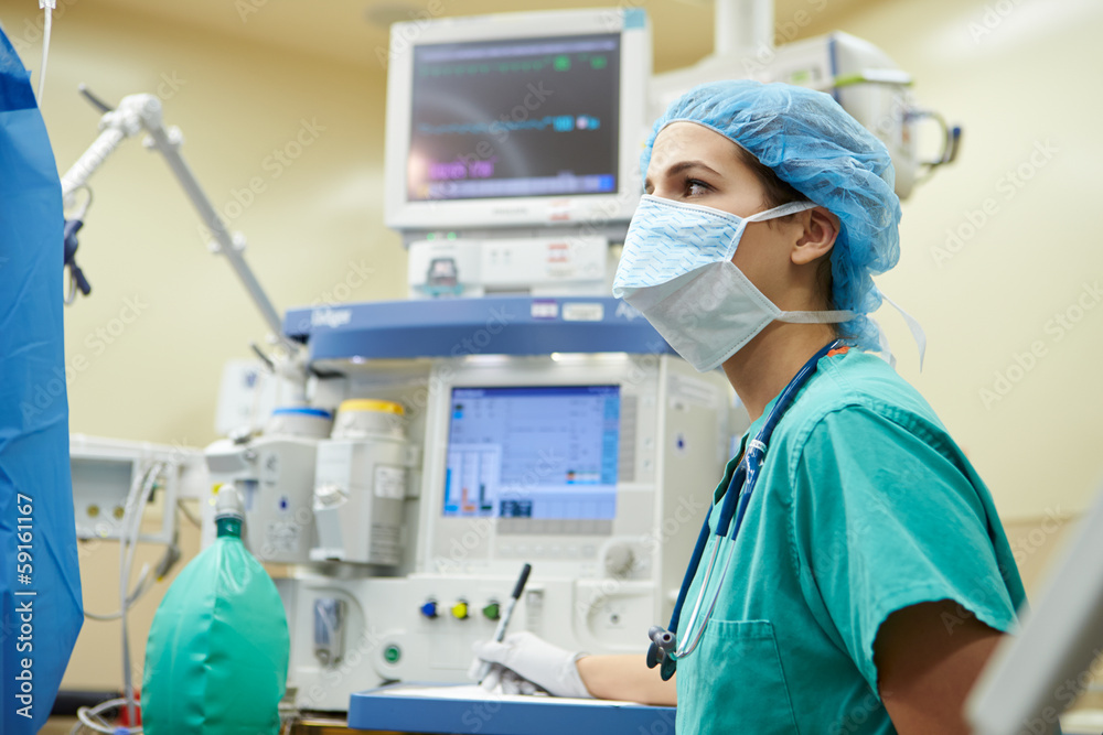 Anesthetist Working In Operating Theatre Anesthetist Working In Operating Theatre