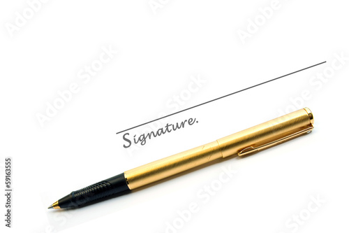 Gold pen and signature isolated on white