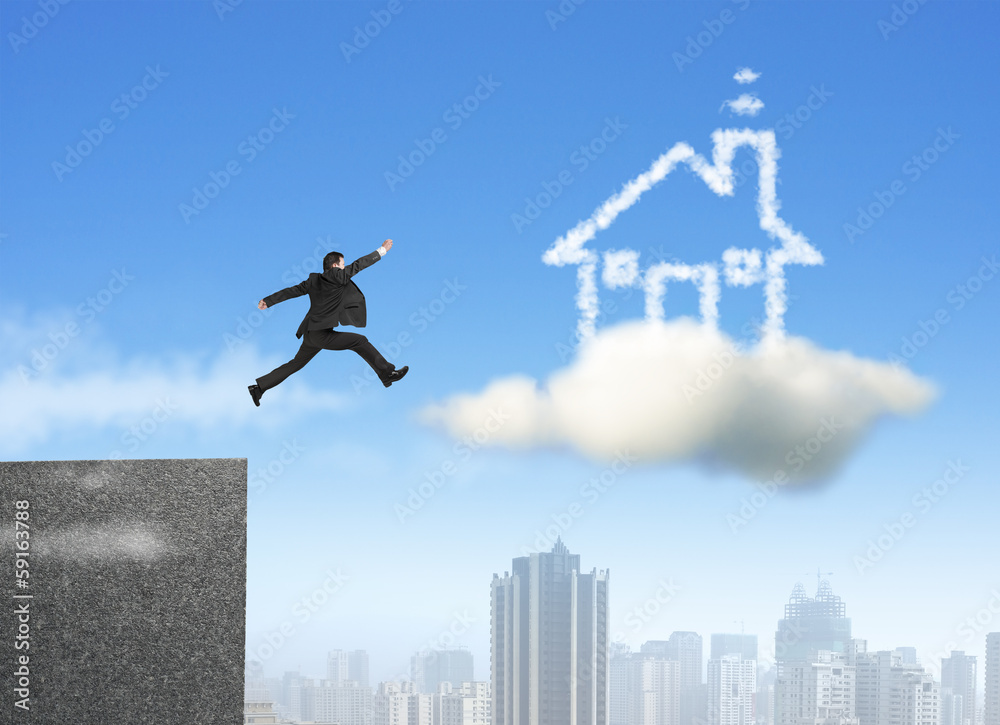 Businessman running and jumping on cloud dream house Businessman running and jumping on cloud dream house