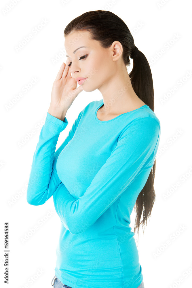 beautiful casual woman touching her temple. beautiful casual woman touching her temple.