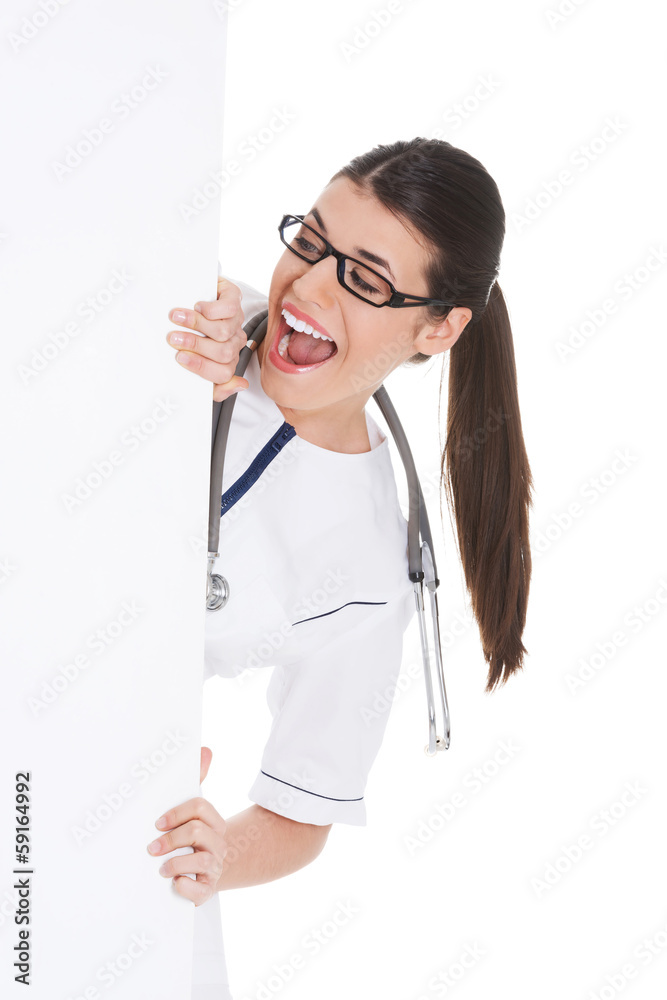 Young female doctor holding copy space. Young female doctor holding copy space.