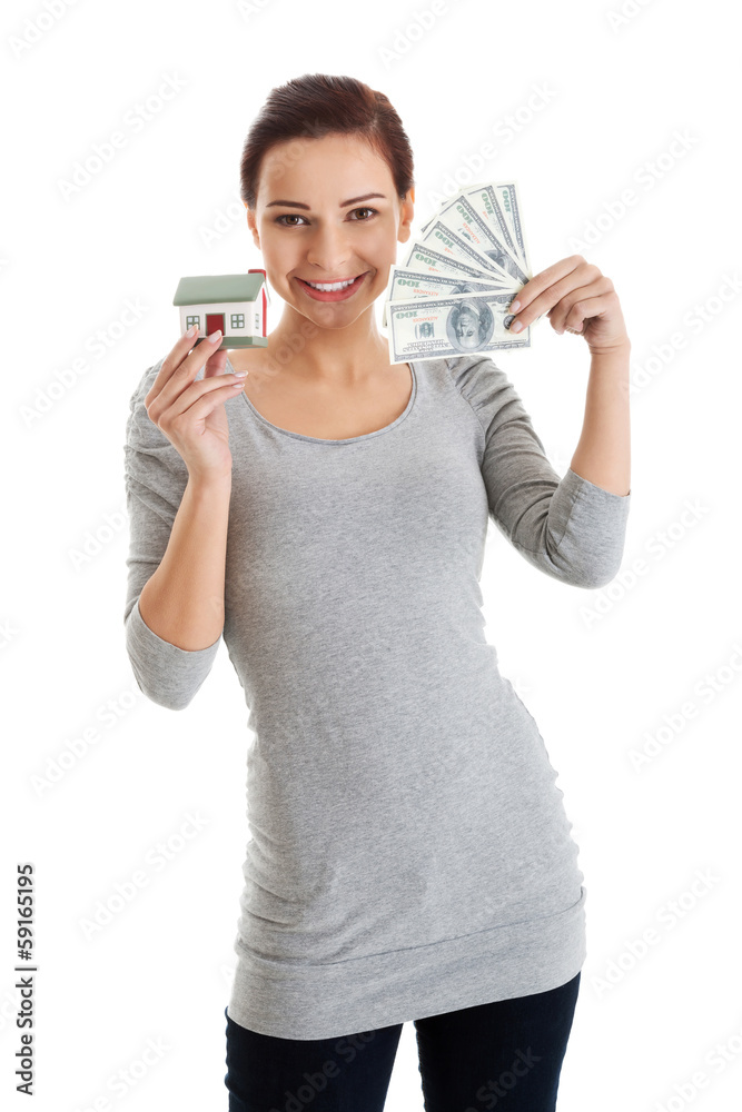 Beautiful casual woman holding money and house. Beautiful casual woman holding money and house.