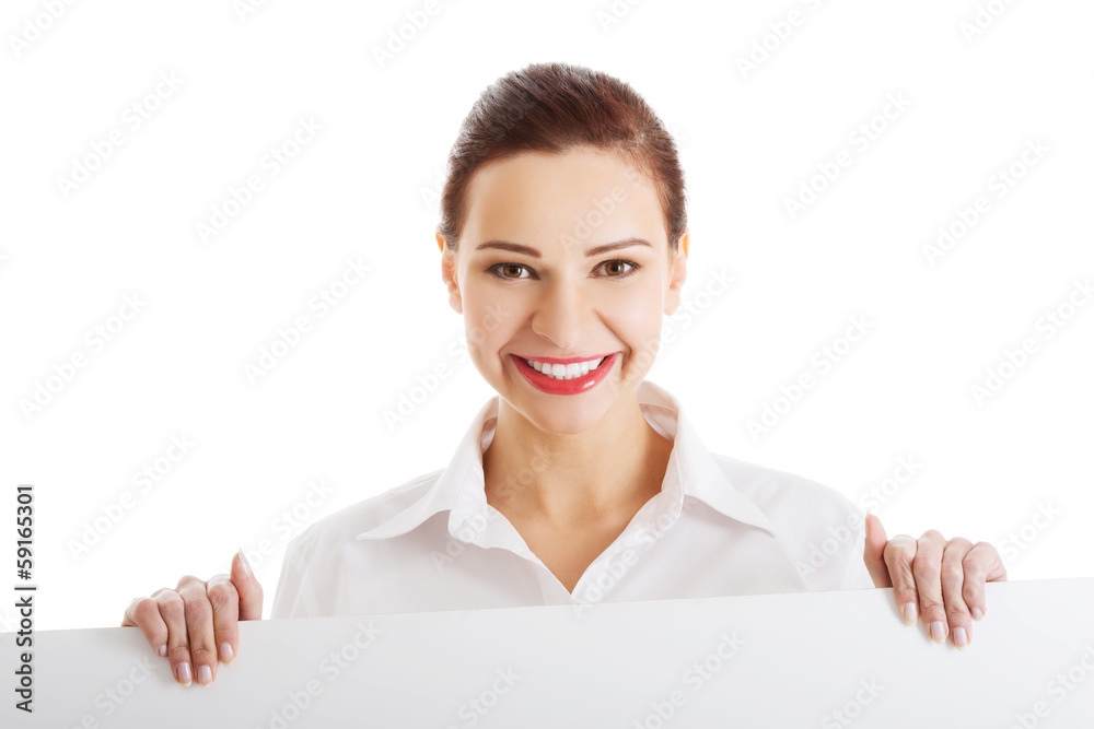 Beautiful young business woman holding copy space. Beautiful young business woman holding copy space.