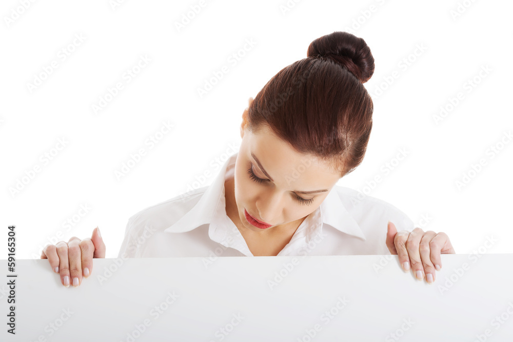 Beautiful young business woman holding copy space. Beautiful young business woman holding copy space.