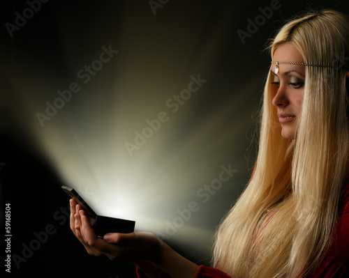 Vászonkép Beautiful blonde woman with glowing box