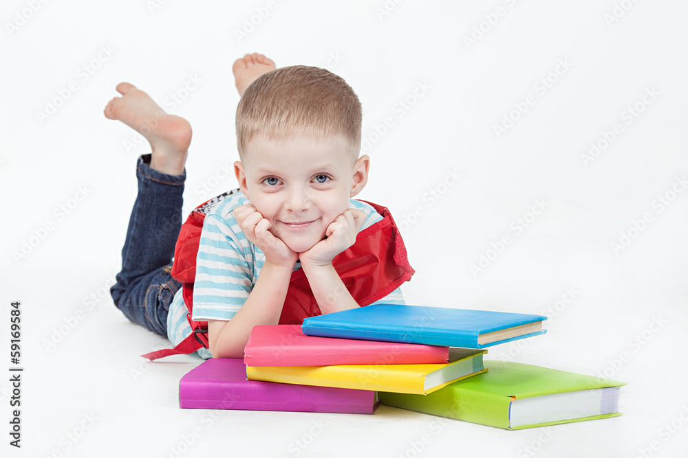 Boy and books isolated on a white background Boy and books isolated on a white background