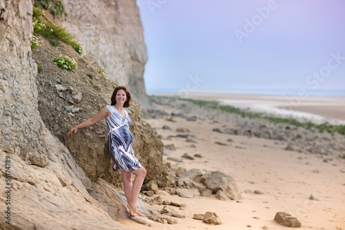 Young attractive pregnant woman relaxing at a beautiful beach