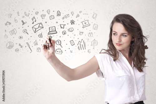 Young woman drawing and sketching icons and symbols