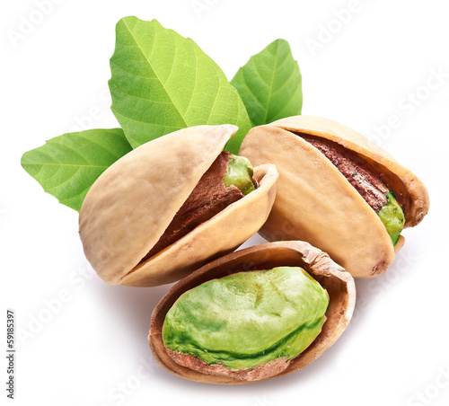 Pistachio nuts with leaves.