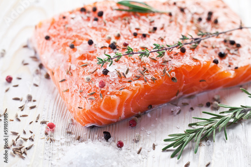 Salmon filet on a wooden carving board.