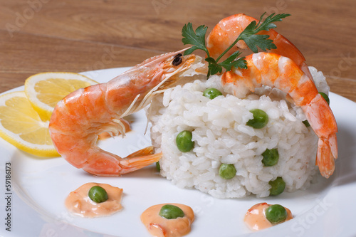 risotto with seafood on wooden table