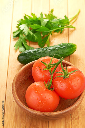 tomatoes in wooden bowlin