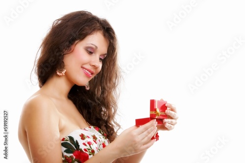 Girl opening small red gift box isolated
