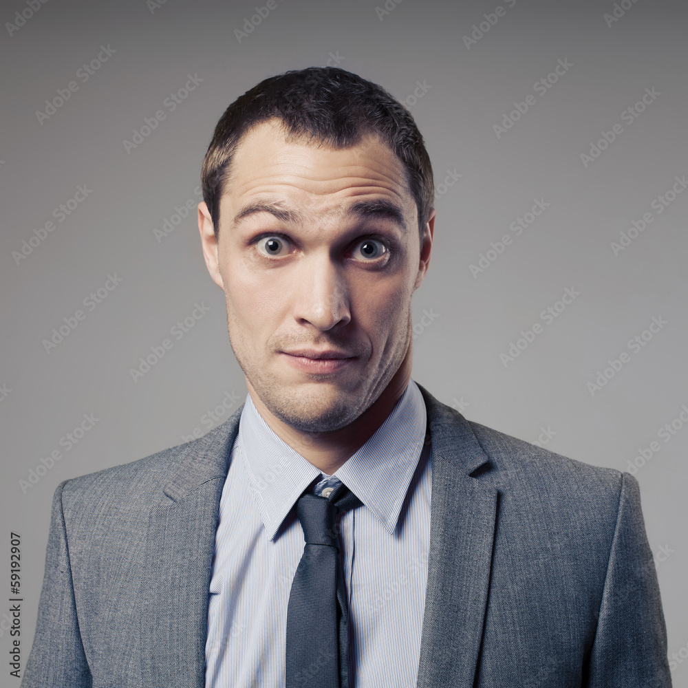 Confused Businessman On Gray Background Confused Businessman On Gray Background