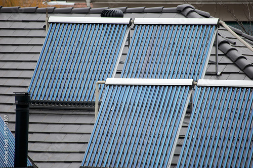 four solar thermal tubes on rooftop