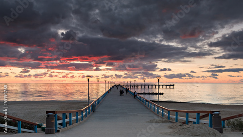 Sunset at a famous pier in resort city of Palanga,