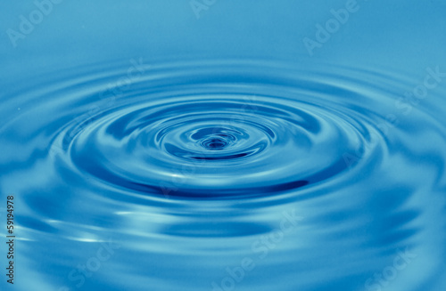 a drop of water falls in the blue. macro...