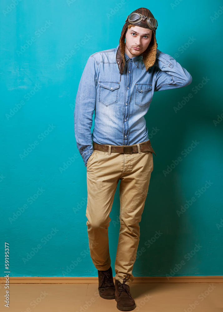 fashion vintage motorcyclist helmet and sunglasses in the studio