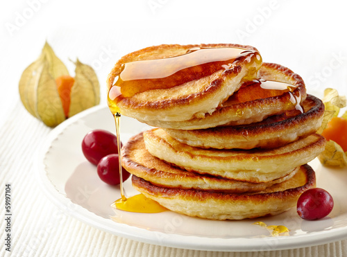 stack of pancakes on white plate