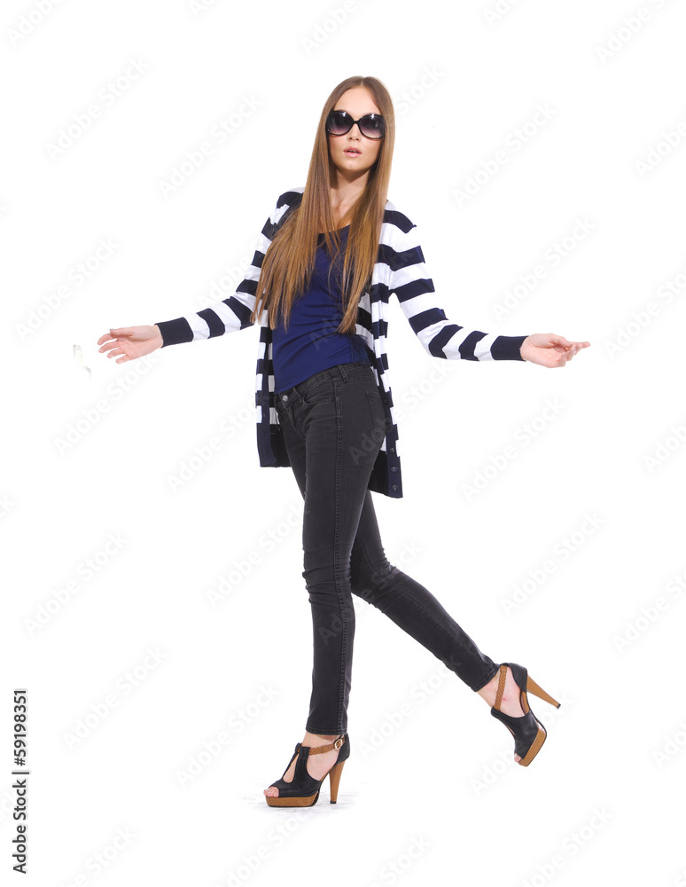 full length young woman in sunglasses with stripy shirt standing full length young woman in sunglasses with stripy shirt standing
