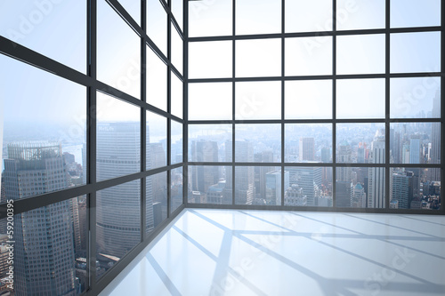 Room with large window showing city