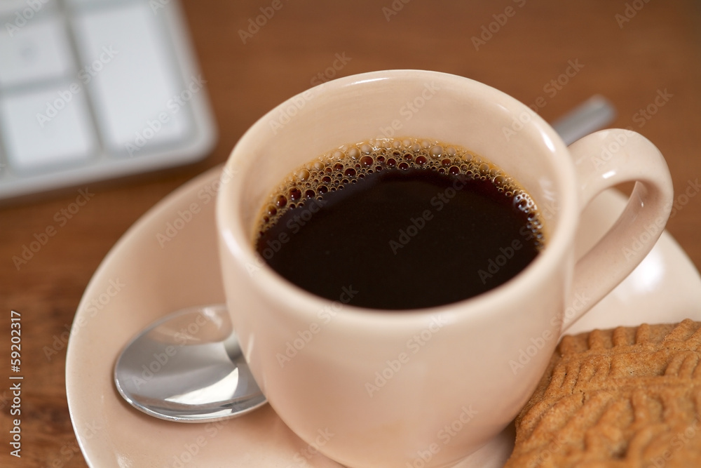 Cup of Coffee on a desk or table Cup of Coffee on a desk or table