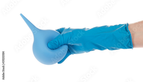 Hand in a glove, holding enema