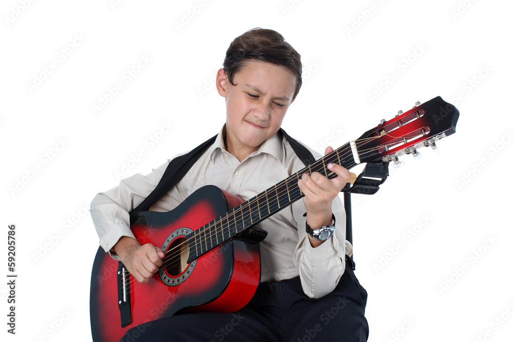 young guitar player performing very passionately on a white back