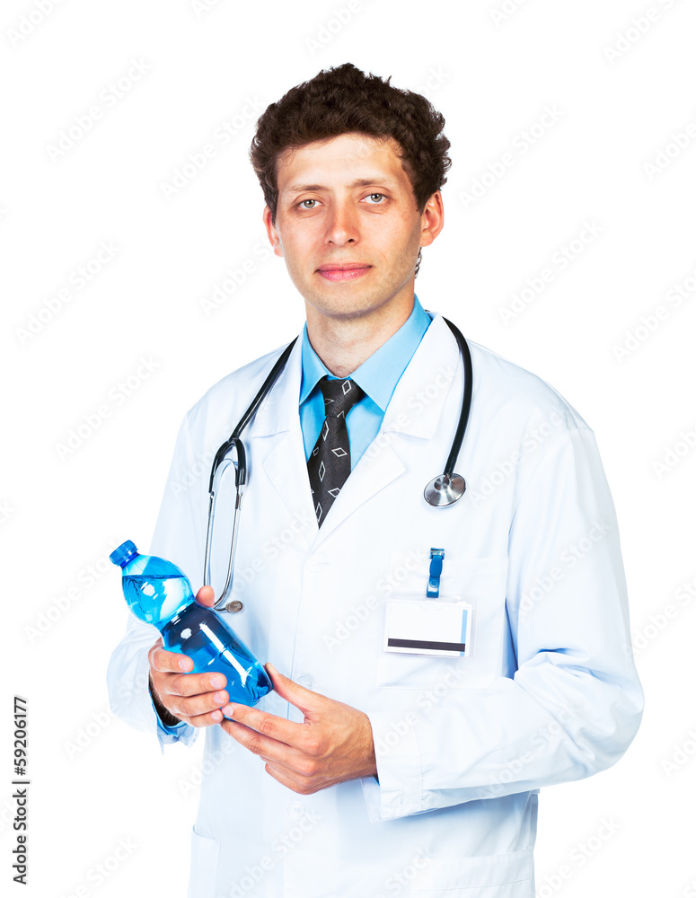 Portrait of a smiling male doctor holding bottle of water on whi Portrait of a smiling male doctor holding bottle of water on whi