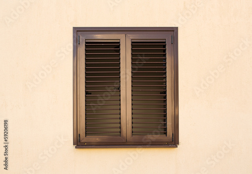 Detail of a window with shutters closed