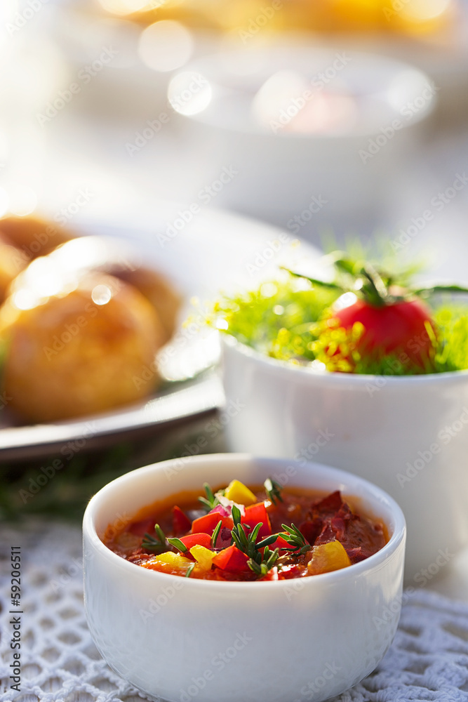 Homemade, fresh tomato and capsicum sauce in the white bowl Homemade, fresh tomato and capsicum sauce in the white bowl