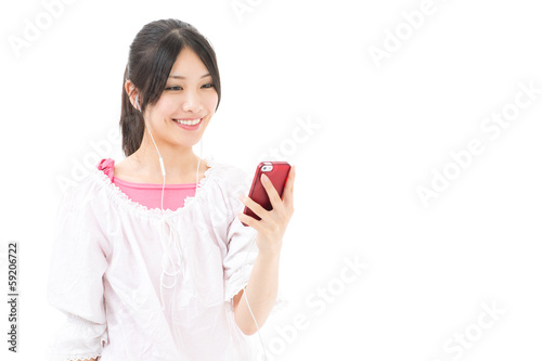 young asian woman using smart phone on white background © taka