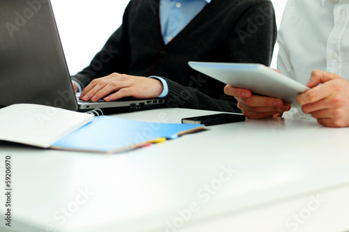 Businesspeople working in office at the table
