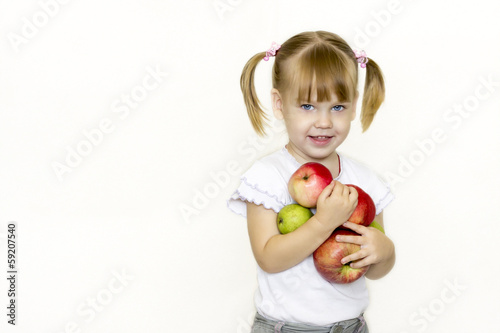 Girl holding a fruit.