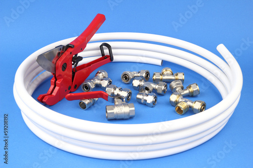The pex pipe and armature on the blue background