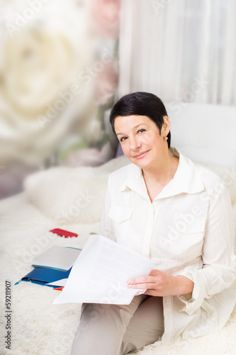 woman with  documents at home photo