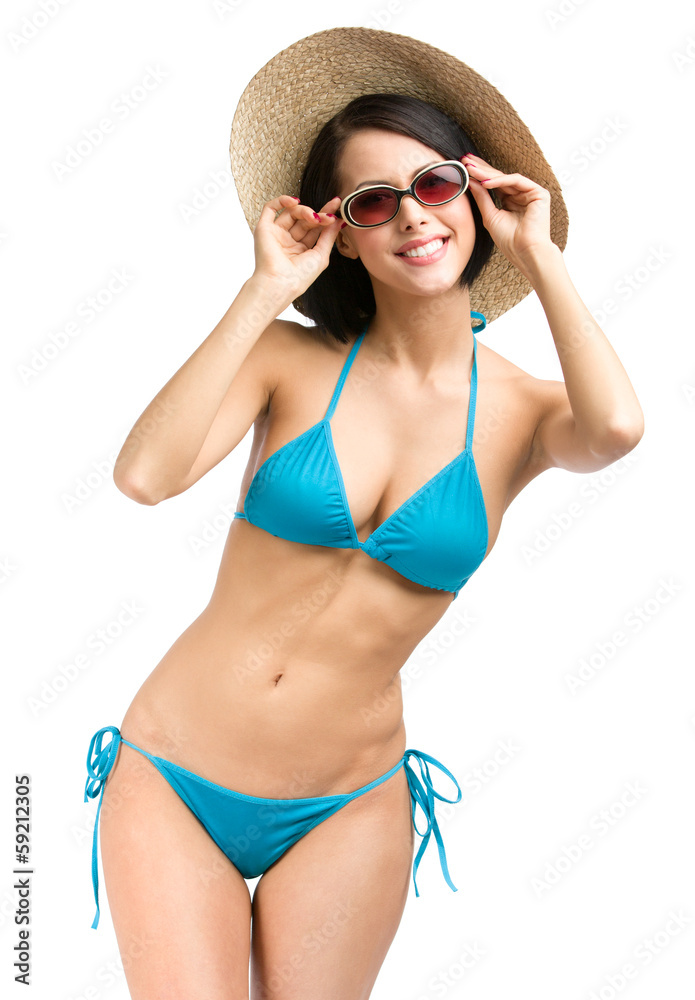 Full-length portrait of young female wearing blue bikini Full-length portrait of young female wearing blue bikini