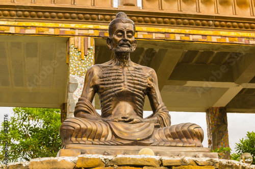 thin buddha statue in Thailand temple